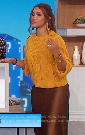 Eve’s yellow sweater and satin skirt on The Talk