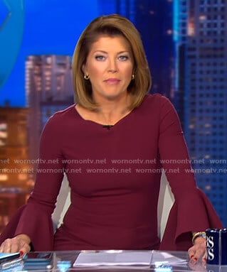 Norah’s burgundy bell sleeve dress on CBS Evening News