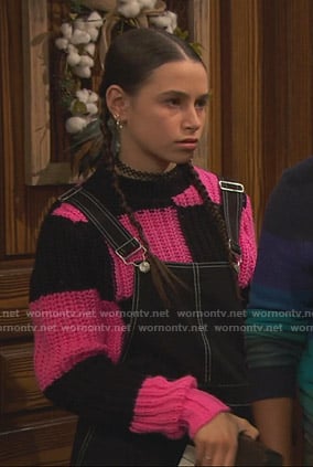 Tess's black and pink checkerboard chunky sweater on Ravens Home