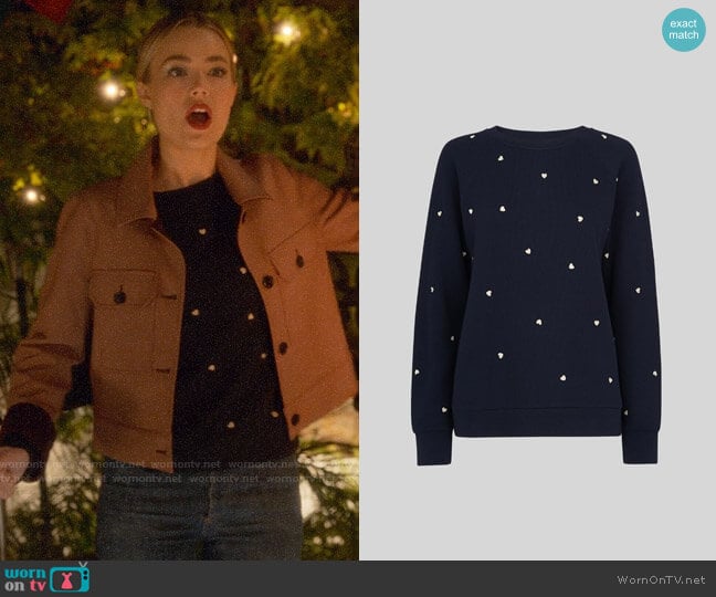 Ainsley’s heart print sweater on Four Weddings and a Funeral