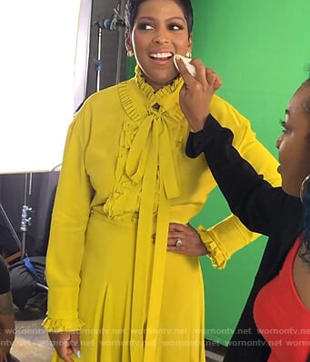 Tamron's yellow ruffled blouse and skirt on Tamron Hall Show