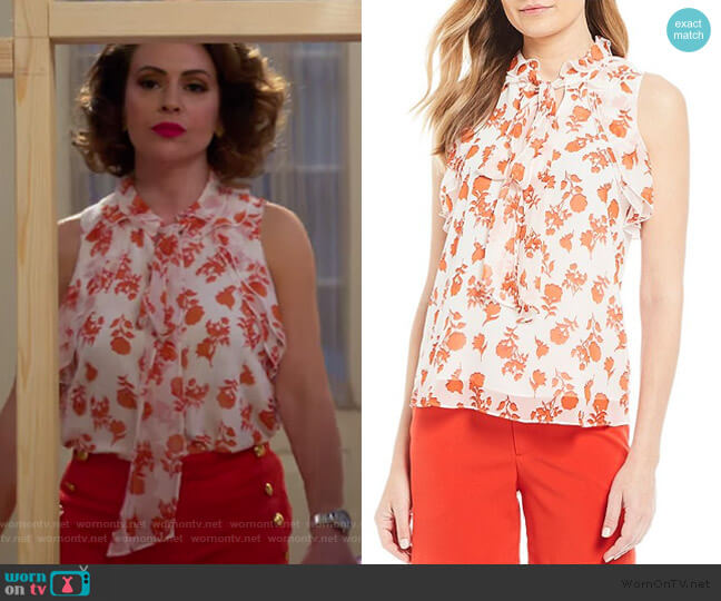 Coralee’s white floral tie neck top on Insatiable