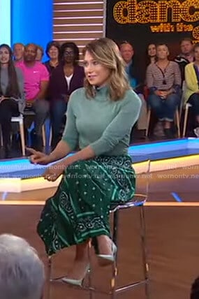 Ginger’s metallic turtleneck sweater and green skirt on Good Morning America