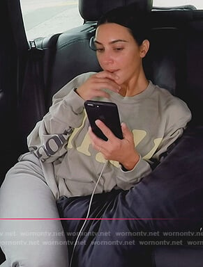 Kim's gray long sleeve top on Keeping Up with the Kardashians