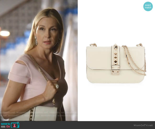 Rockstud Flap Shoulder Bag by Valentino worn by Melissa Daniels (Kelly Rutherford) on Dynasty