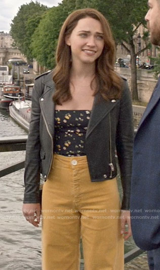 Cara’s black floral tie strap top  with yellow jeans and leather jacket on God Friended Me