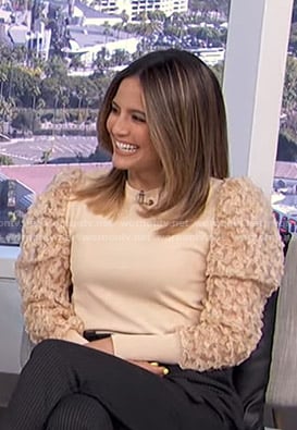 Erin’s beige tulle sleeve sweater on E! News