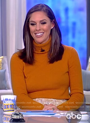 Abby's orange turtleneck sweater and star skirt on The View