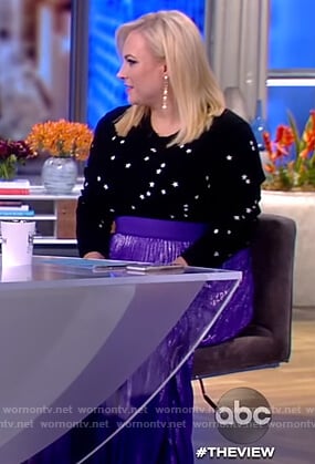 Meghan’s black star sweater and purple skirt on The View