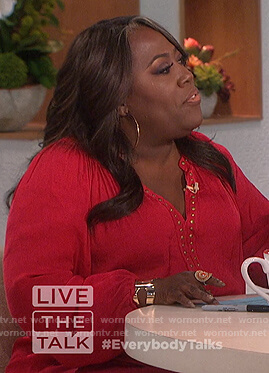 Sheryl’s red studded top on The Talk