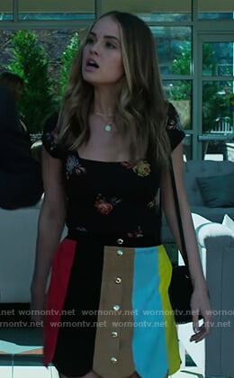 Patty’s black floral top and stripe skirt on Insatiable