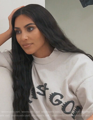 Kim's white Trust God tee on Keeping Up with the Kardashians