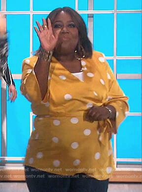 Sheryl’s yellow polka dot wrap top on The Talk