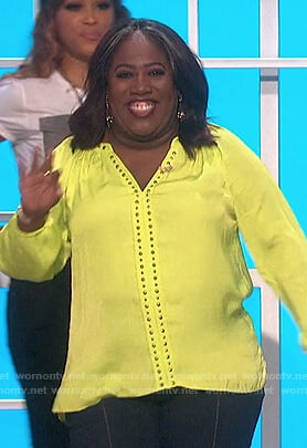 Sheryl’s lime studded v-neck top on The Talk