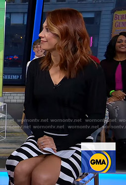 Ginger’s black ribbed v-neck sweater and striped skirt on Good Morning America