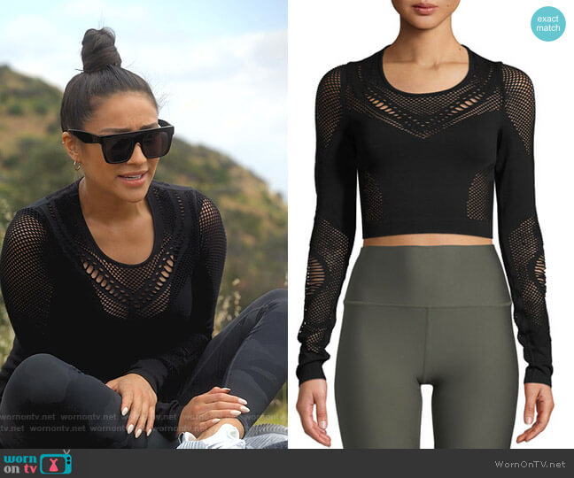 Siren Long-Sleeve Mesh Performance Crop Top by Alo Yoga worn by Stella Cole (Shay Mitchell) on Dollface