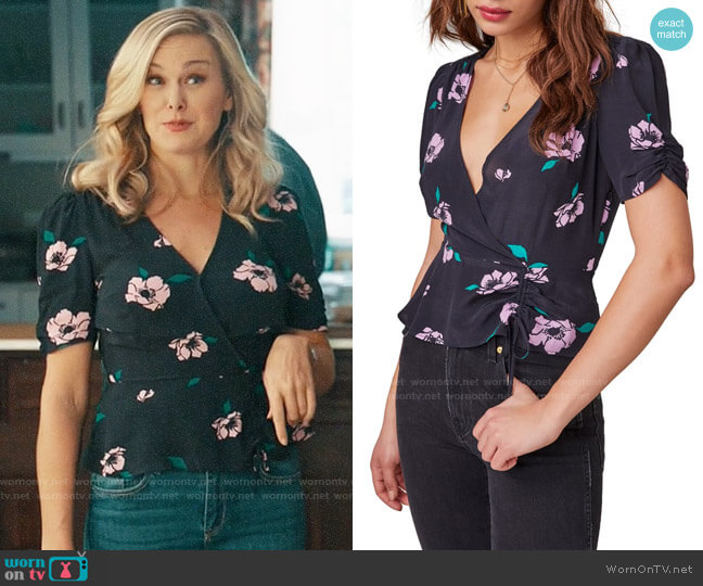 Kimmy’s black floral wrap top on Perfect Harmony