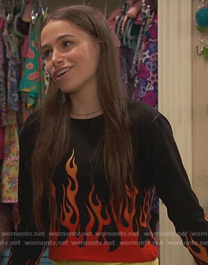 Tess’s black flame print sweater on Ravens Home