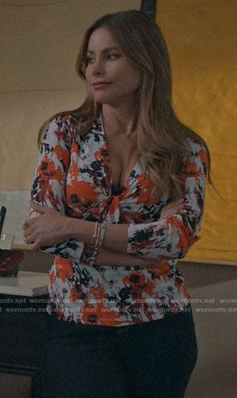 Gloria's red abstract print top on Modern Family