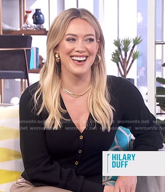 Hilary Duff’s black cardigan and wide leg pants on E! News Daily Pop