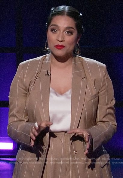Lilly Singh's camel striped suit with ring details on A Little Late with Lilly Singh