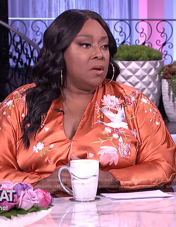 Loni’s orange embroidered wrap dress on The Real