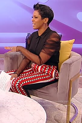 Tamron’s black sheer sleeve blouse and pants on Tamron Hall Show