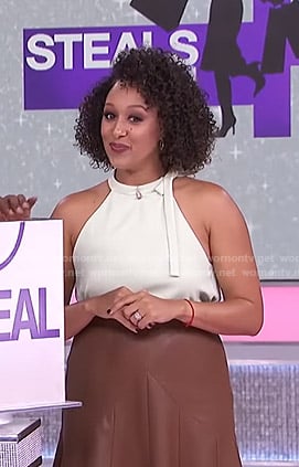 Tamera’s white tie neck top and brown skirt on The Real