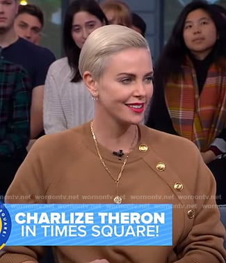 Charlize Theron’s camel button detail sweater on Good Morning America