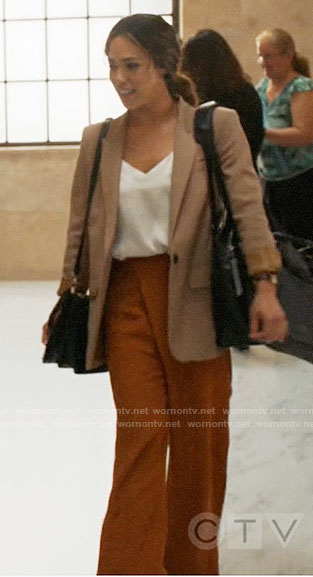 Emily's camel blazer and orange trousers on All Rise