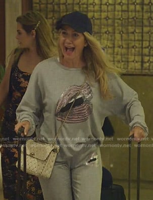 Kary's grey embellished lip print sweatshirt and pants on The Real Housewives of Dallas