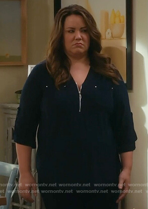 Katie's black zip front blouse on American Housewife