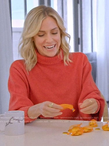 Kristin’s orange cropped back turtleneck sweater on A Very Merry Cavallari