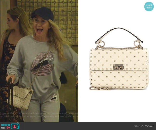 Medium Rockstud Matelassé Quilted Leather Crossbody Bag by Valentino worn by Kary Brittingham on The Real Housewives of Dallas