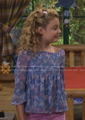 Destiny’s blue butterfly print smocked top on Bunkd