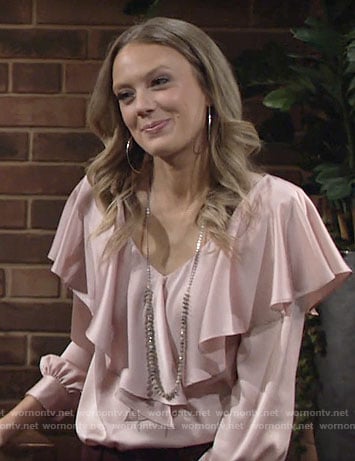 Abby’s pink ruffle overlay blouse on The Young and the Restless