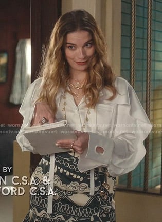 Alexis’s white ruffled blouse and print mini skirt on Schitts Creek