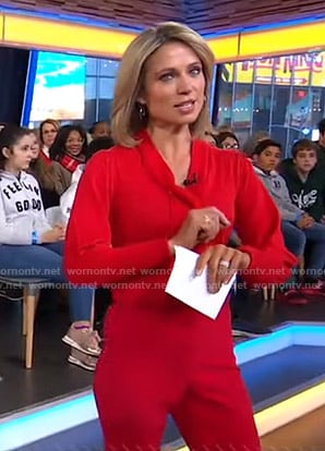 Amy’s red tie neck sweater and pants on Good Morning America