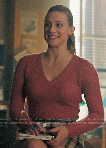 Betty’s pink v-neck sweater and plaid skirt on Riverdale