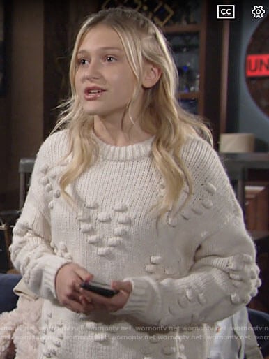 Faith’s white heart bobble sweater on The Young and the Restless