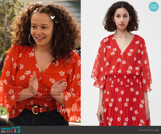 Jade’s red floral blouse on Family Reunion
