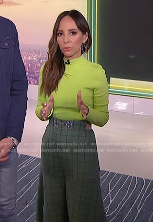 Lilliana's yellow mock neck top and green checked skirt on E! News