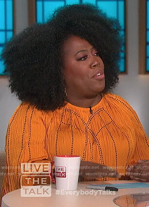 Sheryl’s orange crickled blouse on The Talk