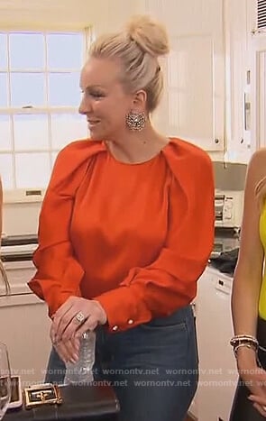 Margaret’s orange satin puff sleeve top on The Real Housewives of New Jersey