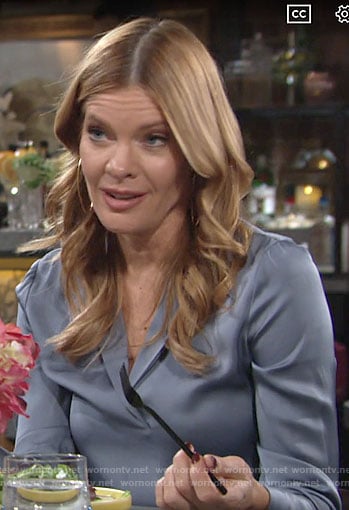 Phyllis’s blue silk split-neck blouse on The Young and the Restless