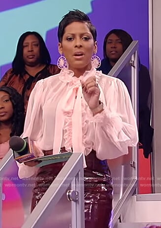 Tamron’s pink ruffle sheer blouse on Tamron Hall Show