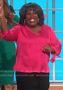 Sheryl’s pink satin tie cuff top on The Talk