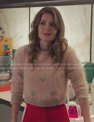 Sutton’s pink heart print sweater on The Bold Type