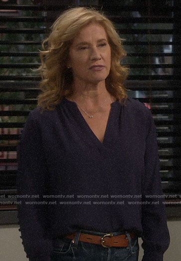 Vanessa's navy buttoned sleeve blouse on Last Man Standing