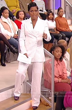 Tamron’s white pinstripe blazer and pants on Tamron Hall Show